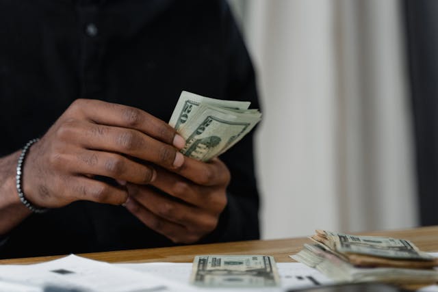 a%20person%20counting%20cash